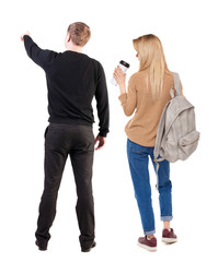 Back view of couple in sweater with mobile phone.