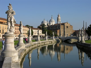 Fototapeta na wymiar Padua, Italy, Prato della Valle, with Statues, Canal, and Basilica of Santa Giustina