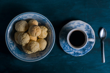 a cup of coffee with chipá, traditional paraguayan snack.
