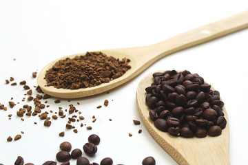 Two wooden spoons with cereal and instant coffee