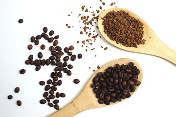 Two wooden spoons with cereal and instant coffee