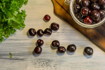 Blackcurrant, black berries for dessert, tea on a white background