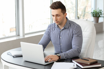 Handsome businessman working in office