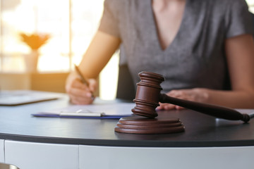 Female lawyer working with document in office