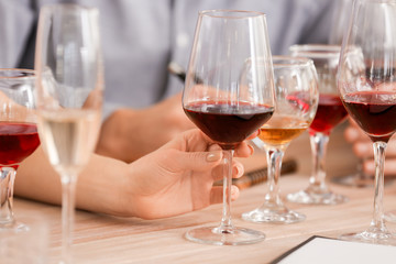 People tasting wine at the restaurant, closeup