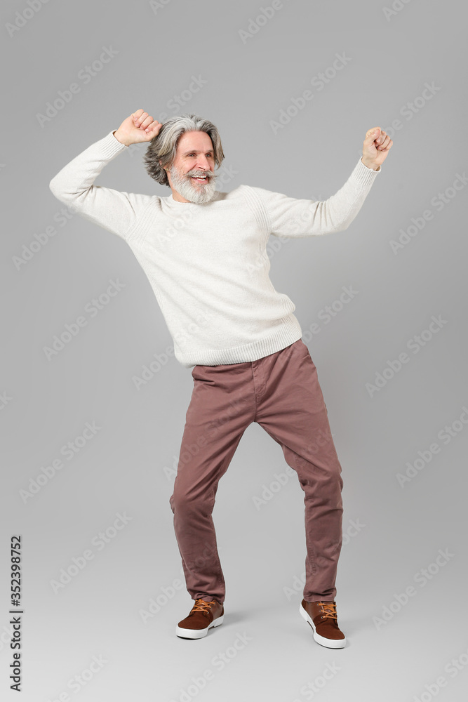 Canvas Prints cool senior man dancing against grey background