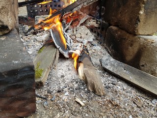 Firewood burns in a fire