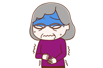 お腹が痛くて真っ青になっている高齢の女性