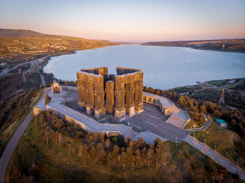 Aerial view down to monument of Chronicles of Georgia in Sakartvelo with Tbilisi sea lake in the background. Sightseeing and tourist sites in Caucasus.Tbilisi Georgia. 2020