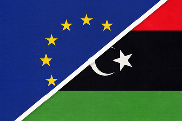 European Union or EU and Libya national flag from textile. Symbol of the Council of Europe association.