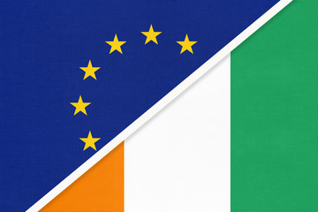 European Union or EU and Ivory Coast national flag from textile. Symbol of the Council of Europe association.