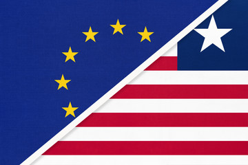 European Union or EU and Liberia national flag from textile. Symbol of the Council of Europe association.