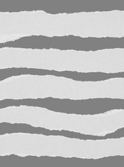 Naklejka premium White torn paper collection isolated on grey background, ripped blank mockup.