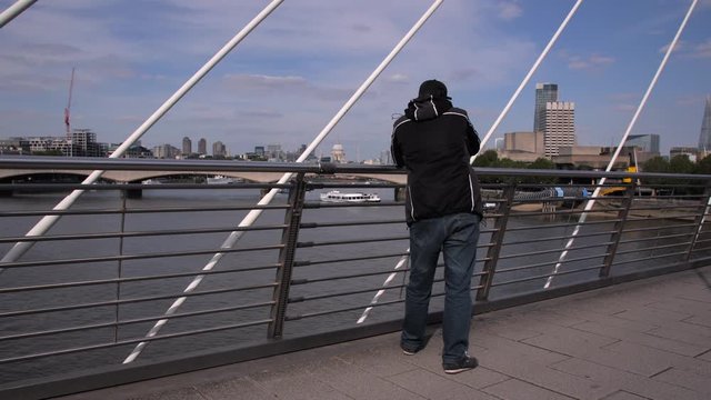 Photographer taking picture of Waterloo Bridge in London