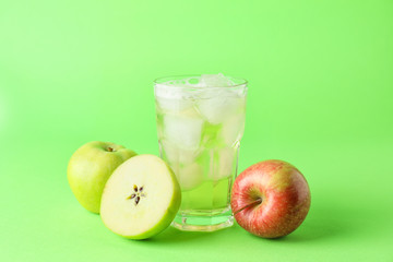 Plakat Glass of cold apple cider on color background