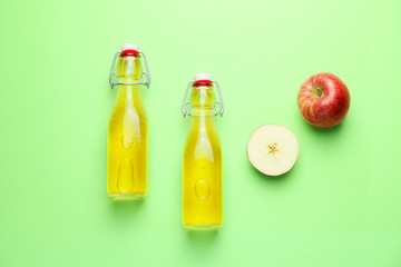 Composition with fresh apple cider on color background