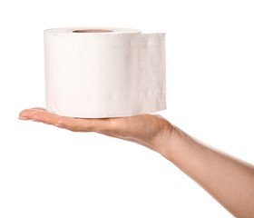 Hand with roll of toilet paper on white background