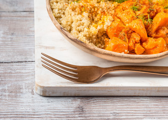 Vegan quinoa bowl with baked spiced pumpkin, fennel, bell pepper and turmeric. Healthy gluten free lunch or dinner