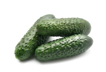 Fresh green cucumbers on white background