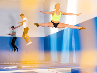 People training in trampoline center