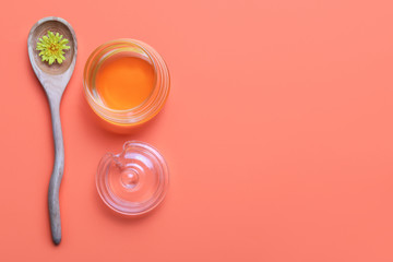 Composition with sweet dandelion honey on color background