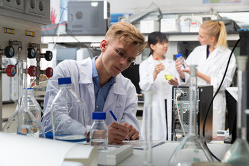 Male scientist working at biochemical laboratory