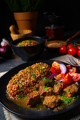 Buckwheat groats baked in the oven with beef goulash