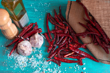 Red hot chili peppers on blue table, for sauce.