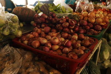Onion stacks combined that are put up for sale in the market.