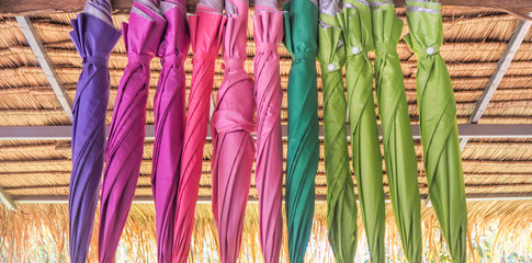 Colorful umbrellas hanging in line