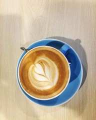 cup of coffee on wooden table