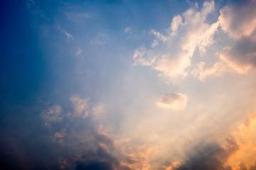 Fototapeta premium White clouds in the golden sky in the evening