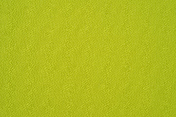 A fragment of a light green chiffon photographed in close-up.
