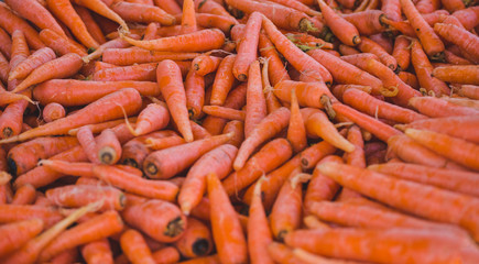Fresh carrots on a market counter.