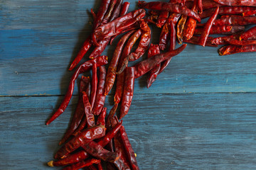 Red hot chili peppers on blue table, for sauce.