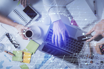 Double exposure of man's hands typing over computer keyboard and data theme hologram drawing. Top view. Technology concept.