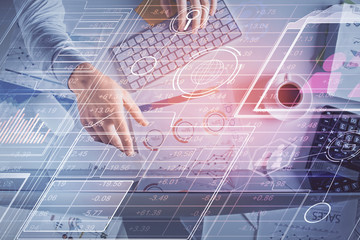 Double exposure of man's hands typing over computer keyboard and data theme hologram drawing. Top...