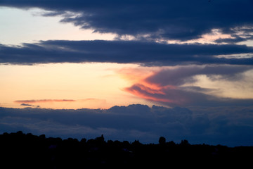 Fiery orange and blue sunset sky. Beautiful sky. Background nature. Life