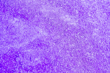 Purple stucco texture. Purple rough surface. Selective focus