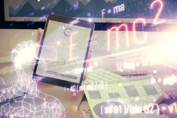 Double exposure of man's hands holding and using a phone and formulas drawing. Education concept.