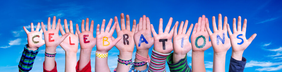 Children Hands Building Colorful English Word Celebrations. Blue Sky As Background