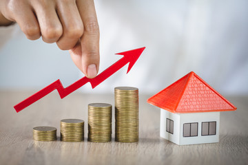  planning savings money of coins to buy a home, concept for property ladder, mortgage and real estate investment. for saving or investment for a house, growing business