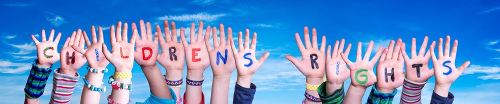 Children Hands Building Colorful English Word Children Rights. Blue Sky As Background