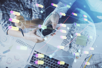 Double exposure of map drawing and man and woman working together holding and using a mobile device. Planet tech concept.