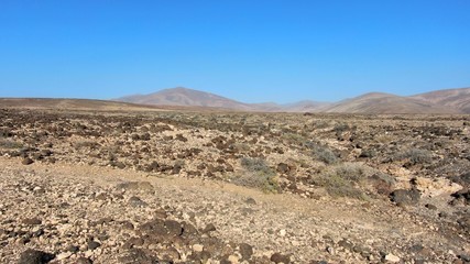 Walkuing along the coast contempalting the wonders of nature with its natural swimming pools and its ocean