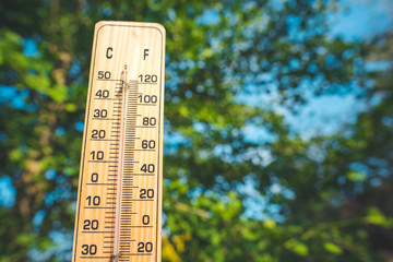 Thermometer  shows higt temperatures in celsius or farenheit.
