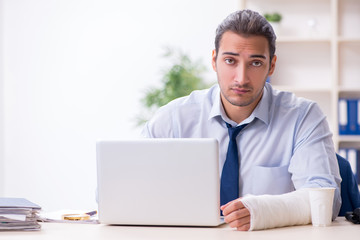 Injured male employee at workplace after accident