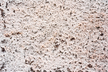 Texture of a concrete wall with cracks and scratches which can be used as a background