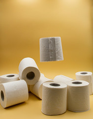 White toilet paper for the bathroom with yellow background