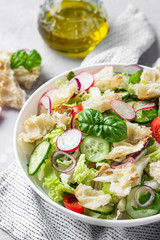 Vegetarian fattoush salad. Traditional Middle Eastern salad with toasted pita bread and vegetables. Lebanese cuisine.